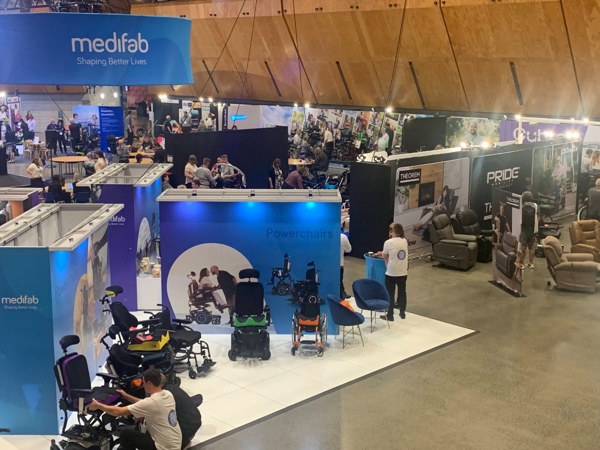 Expo Hall - Medifab booth in the middle with power wheelchairs