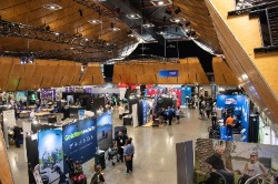 Different high angle view of the Expo Hall - booths, attendees looking around