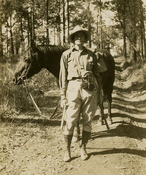Dorothy Hill standing with horse on a geology excursion, 1930