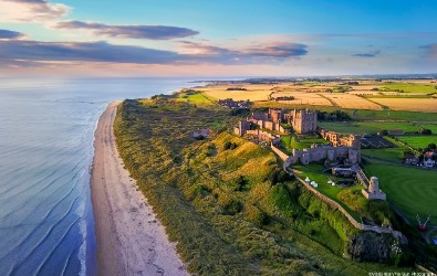 Aerial view of Bamburgh Castle on the coast of Northumberland, England
