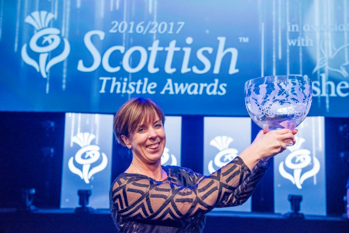 2016/17 Silver Thistle winner, Freda Newton holding the Silver Thistle trophy