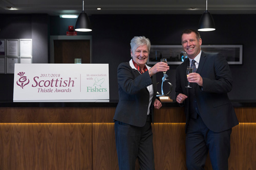 Tourism & Hospitality Hero winner, Jean Ryrie pictured with Scott Inglis from Headline sponsor, Fishers